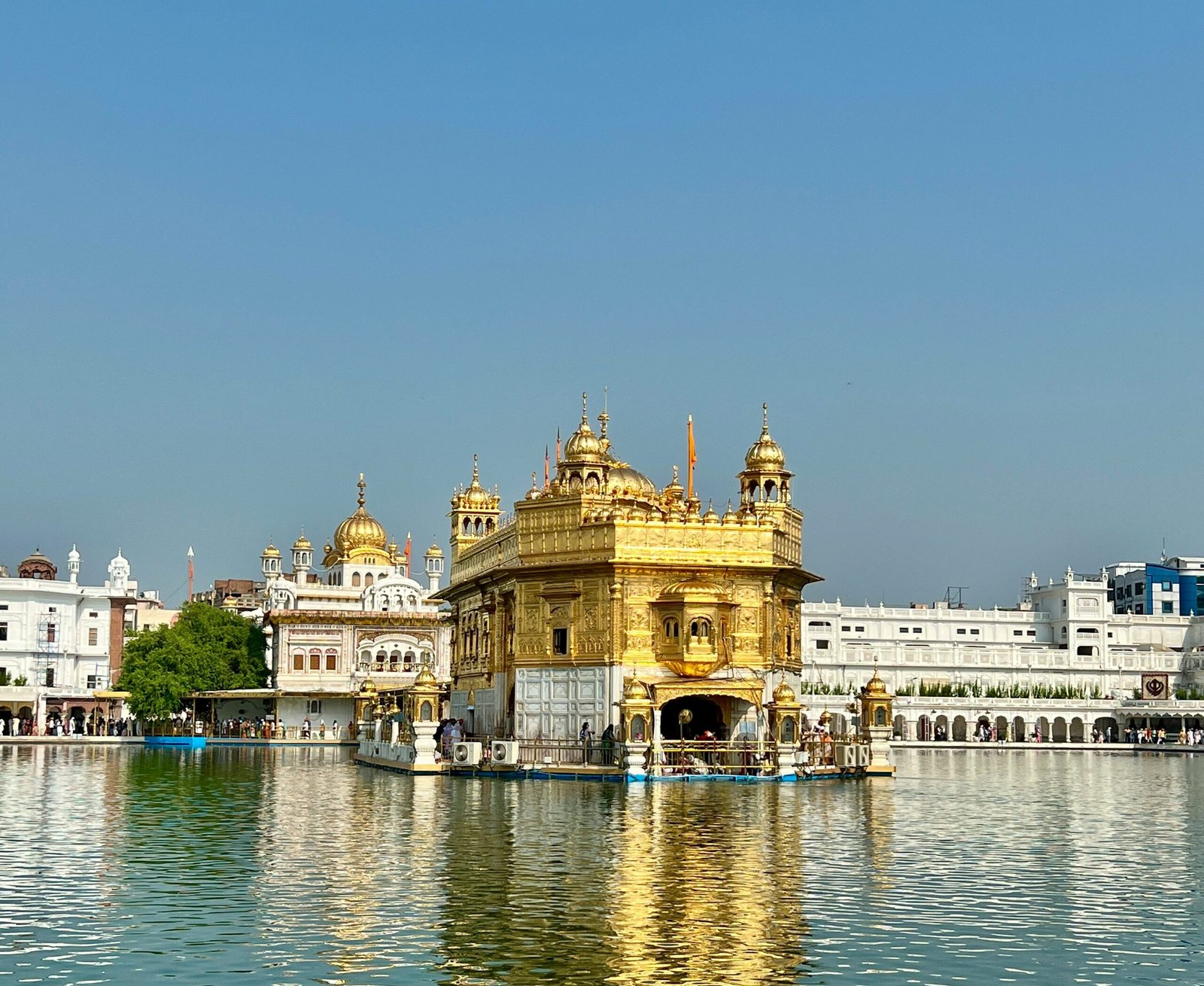 a large body of water with a building in the background